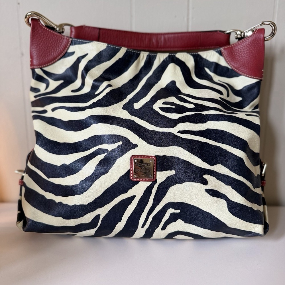 Dooney & Bourke Black and Cream Zebra Print Hobo with Red Trim